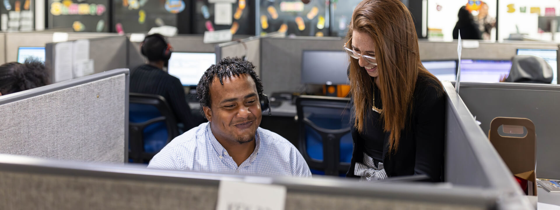 Westgate sales employees smiling in an office.