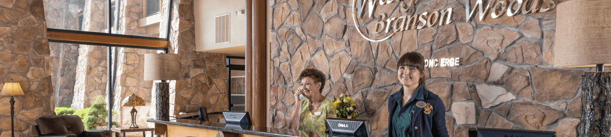 Two front desk workers at Westgate Branson Woods