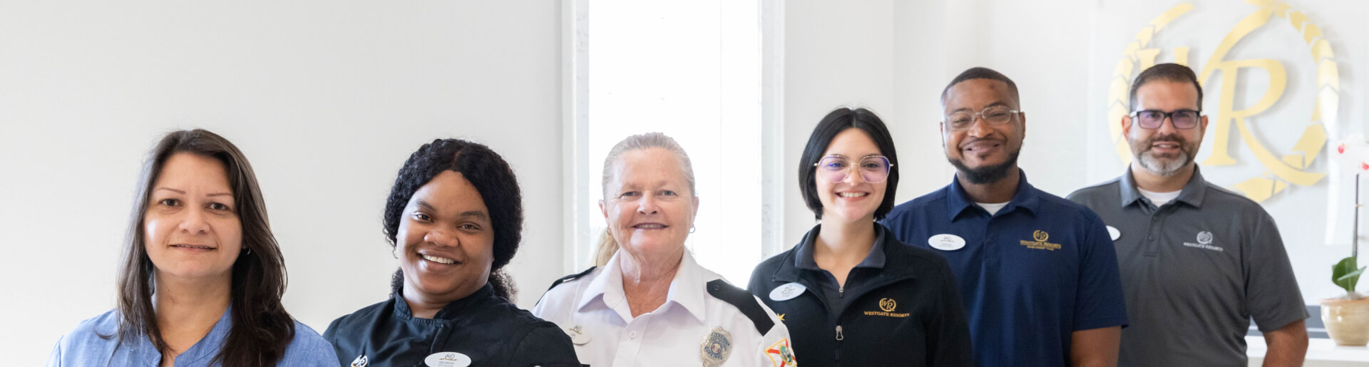 Westgate employees standing in a line smiling.