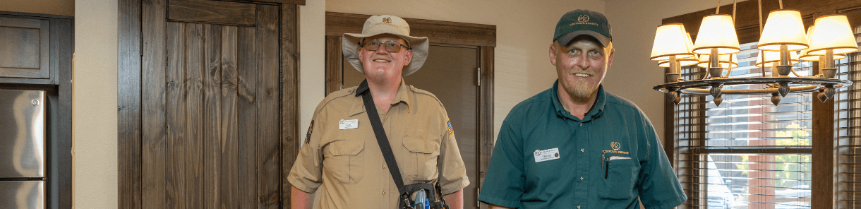WG maintenance employees stood smiling in a room.