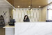 Westgate Front Desk ops - a woman smiling behind the desk on the telephone