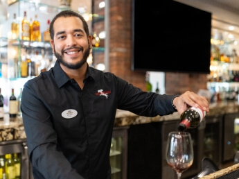 bartender at Westgate pouring drinks