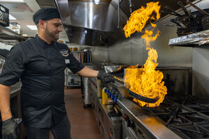 Chef cooking in the kitchen at Westgate