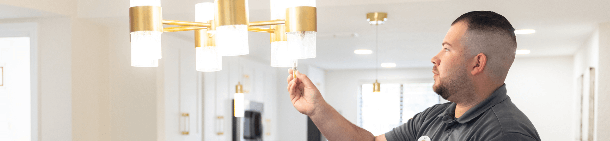 Westgate Resorts Maintenance employee fixing a light