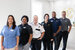 Westgate employees standing in a line smiling.
