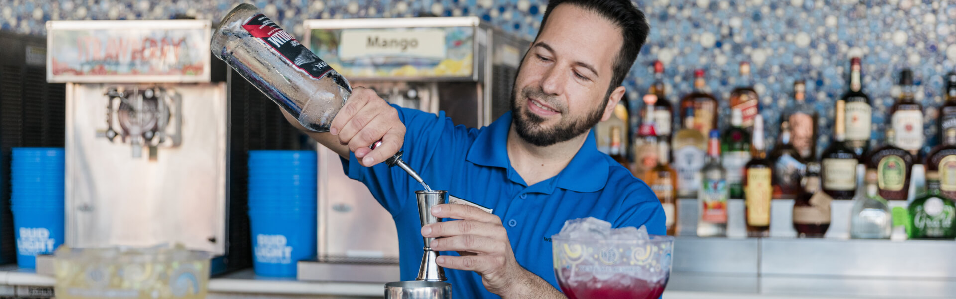 A bartender mixing cocktails 