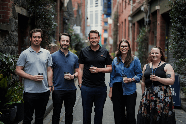 a circular overlay with two men walking down a street with text