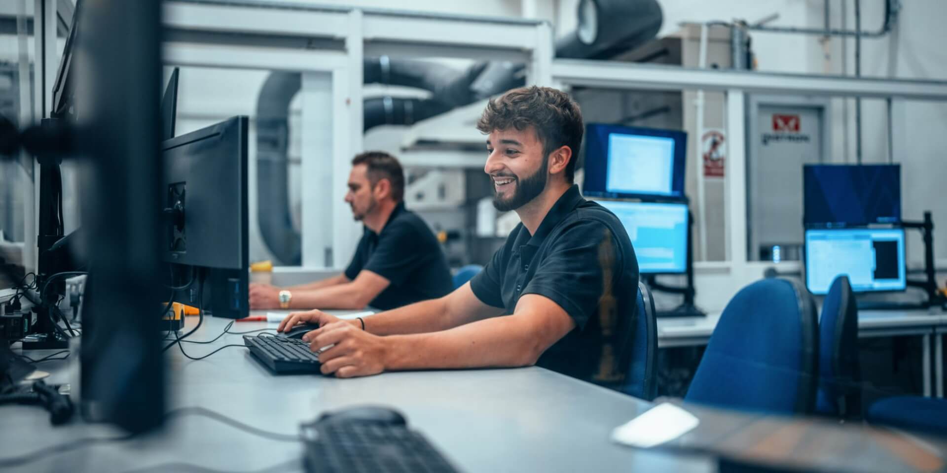 a man working behind a computer