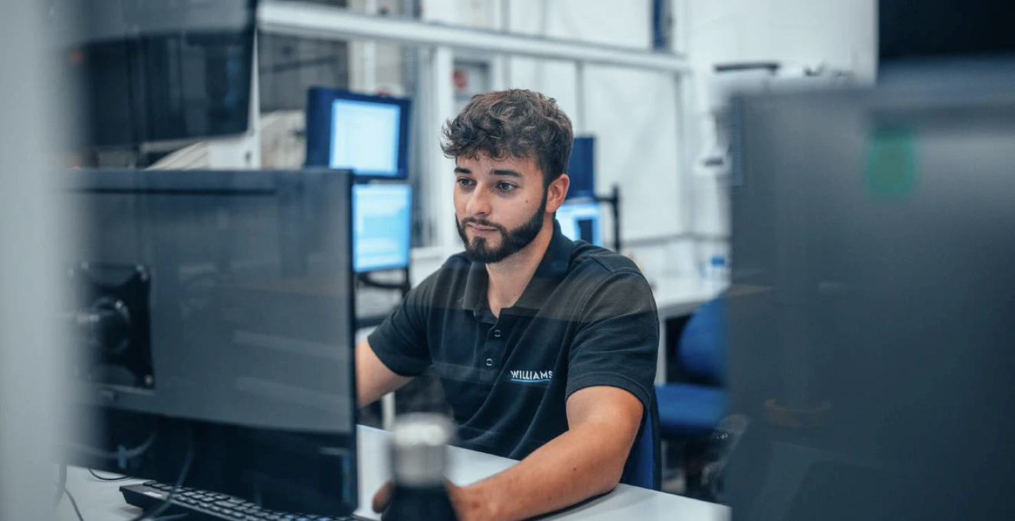 a man working behind a computer