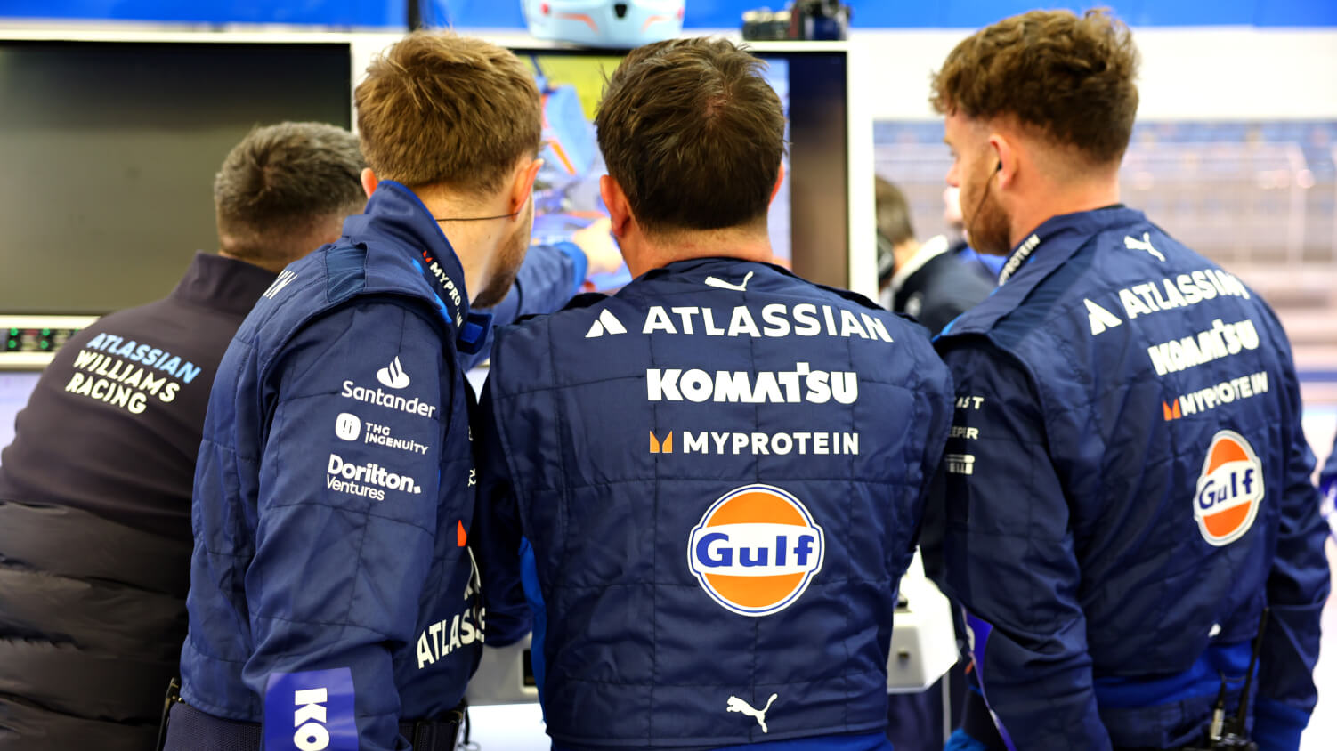 a man working behind a computer