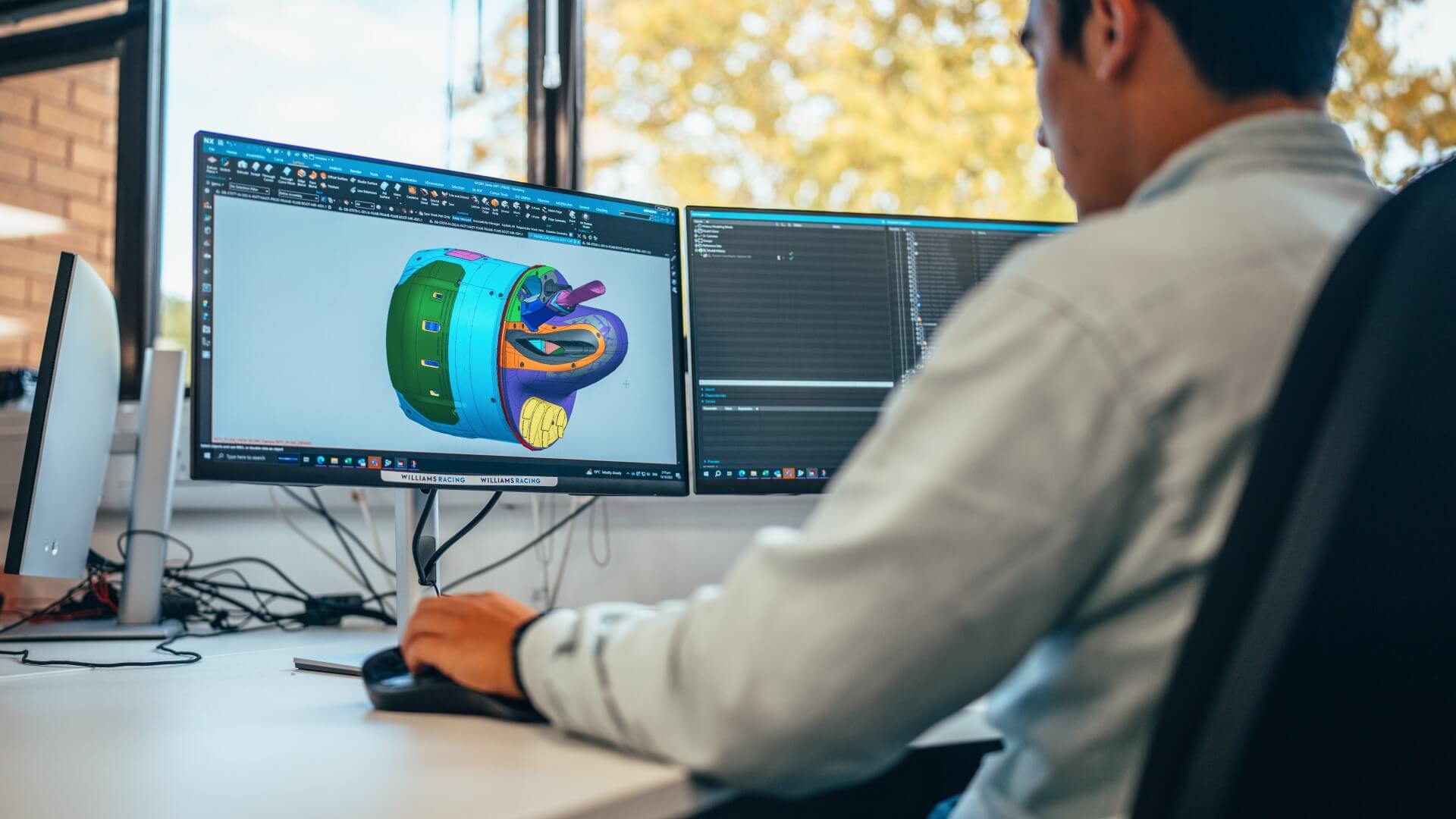 a man working behind a computer