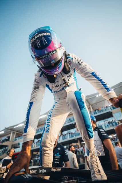 A williams F1 driver leaving the car