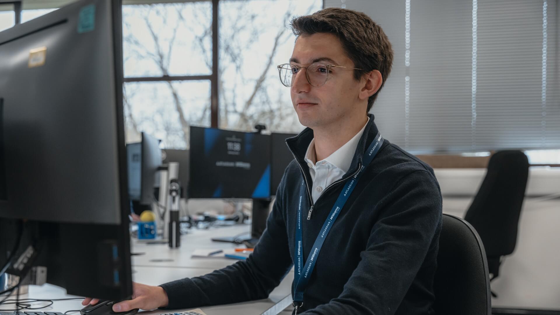 a man working behind a computer