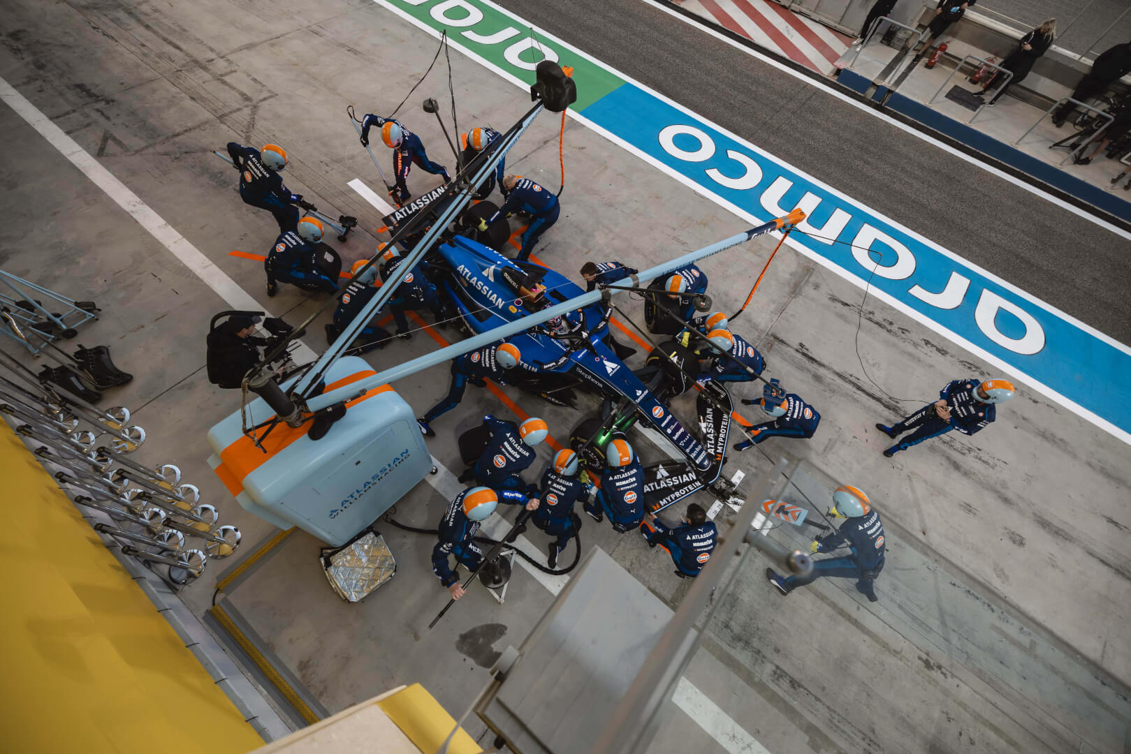 Assembly technicians working on a race car