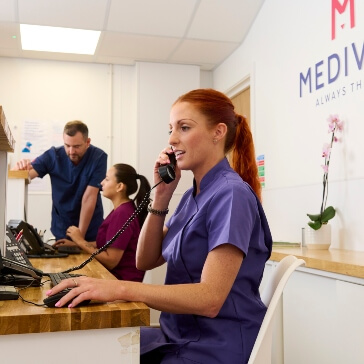 vet holding a small cat