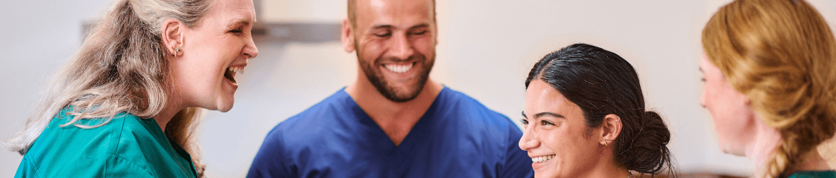 Group of vets and nurses smiling together