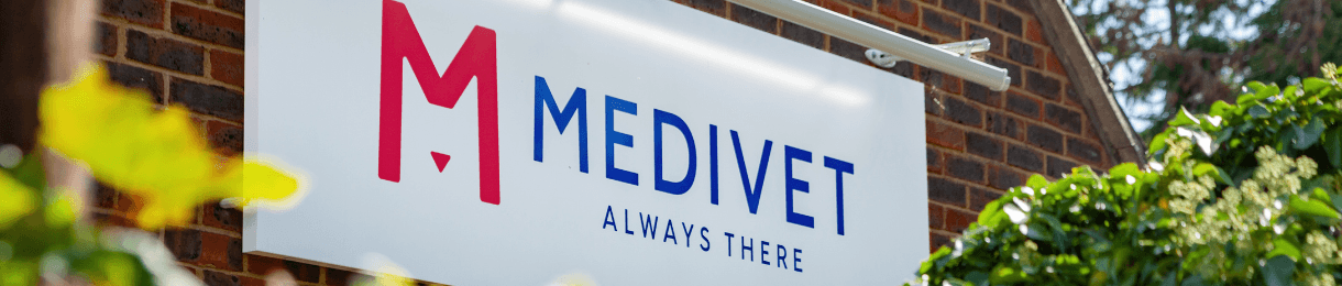Medivet logo and "Always There" slogan on a sign at the side of a building.