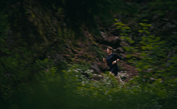 A man running out in the woods