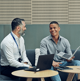 Two male colleagues talking to eachother