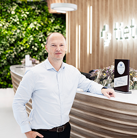 A man smiling to the camera