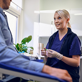 A nurse talking to a patient