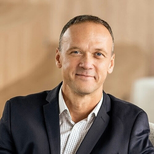 A man smiling to the camera