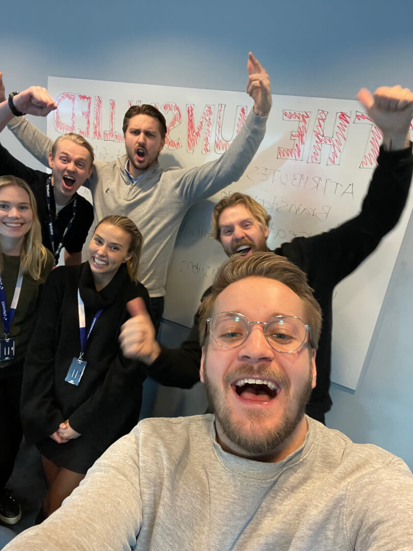 Happy people laughing and looking into the camera