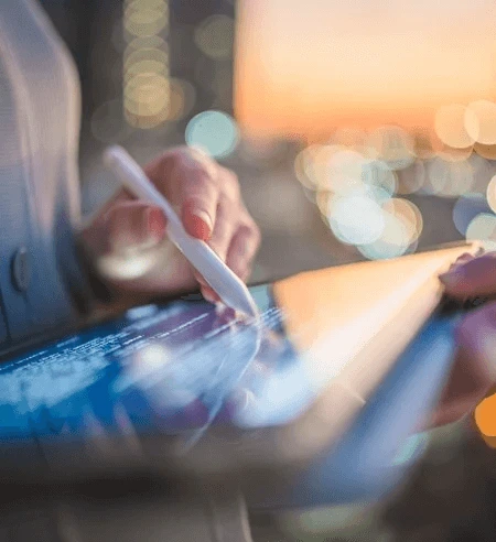 Someone writing on a tablet