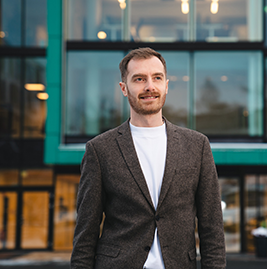 A man standing outside of a building
