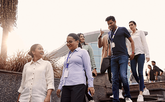 People walking down a stair talking and laughing