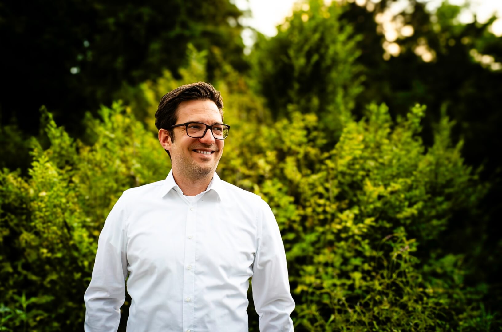 Man standing outdoors and smiling