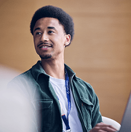 A man with brown hair smiling