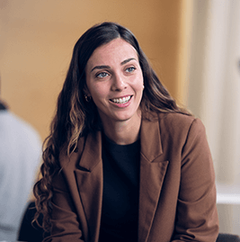A woman with brown hair smiling