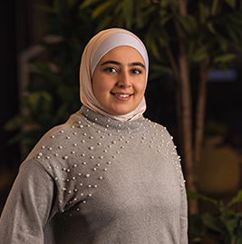 A woman smiling to the camera