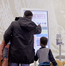 A man pointing on a screen 