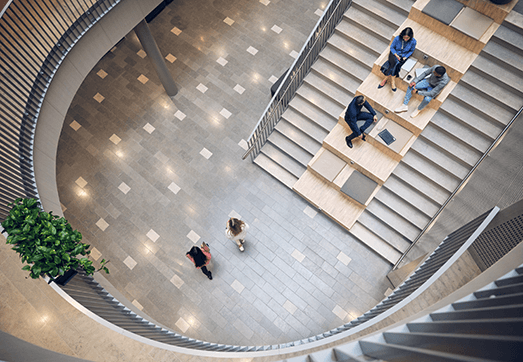 A picture of colleagues talking to each other at one of Tietoevry's offices.