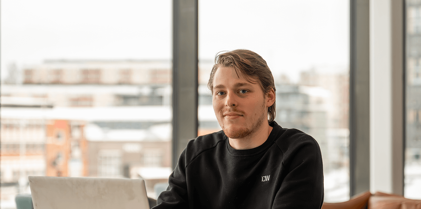 A picture of Nils sitting by his computer in our Karlstad office