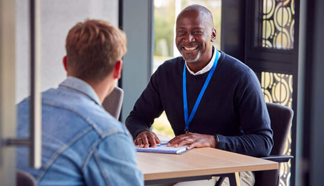 A man having a meeting with another person.