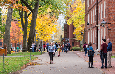 People walking through Cambridge campus.