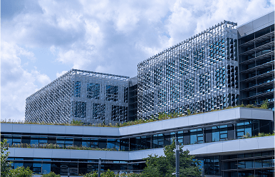 Innovation and research building on Harvard’s Allston campus with geometric facade and rooftop greenery.