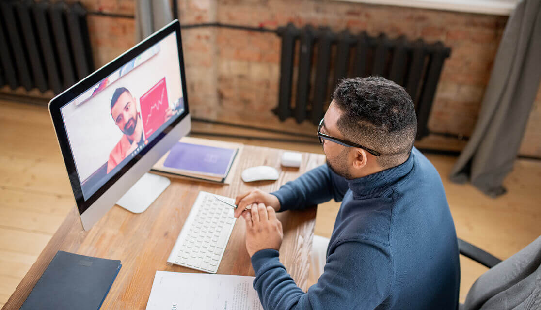 A man participating in a video conference call.
