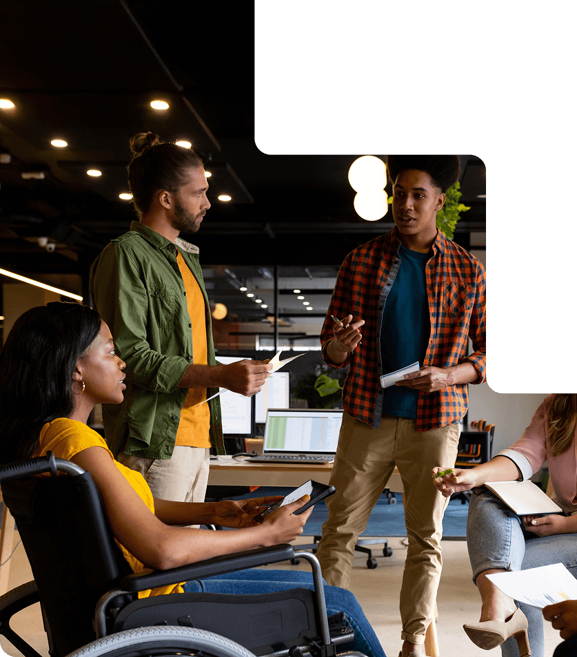 An image of four people working together