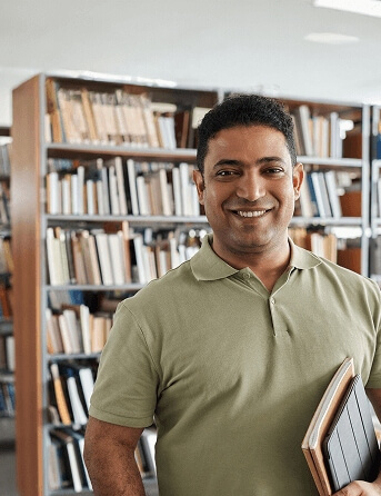 Image of person smiling in a library