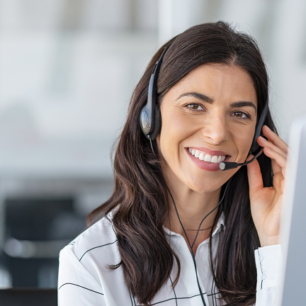 A picture of a woman smiling on the phone