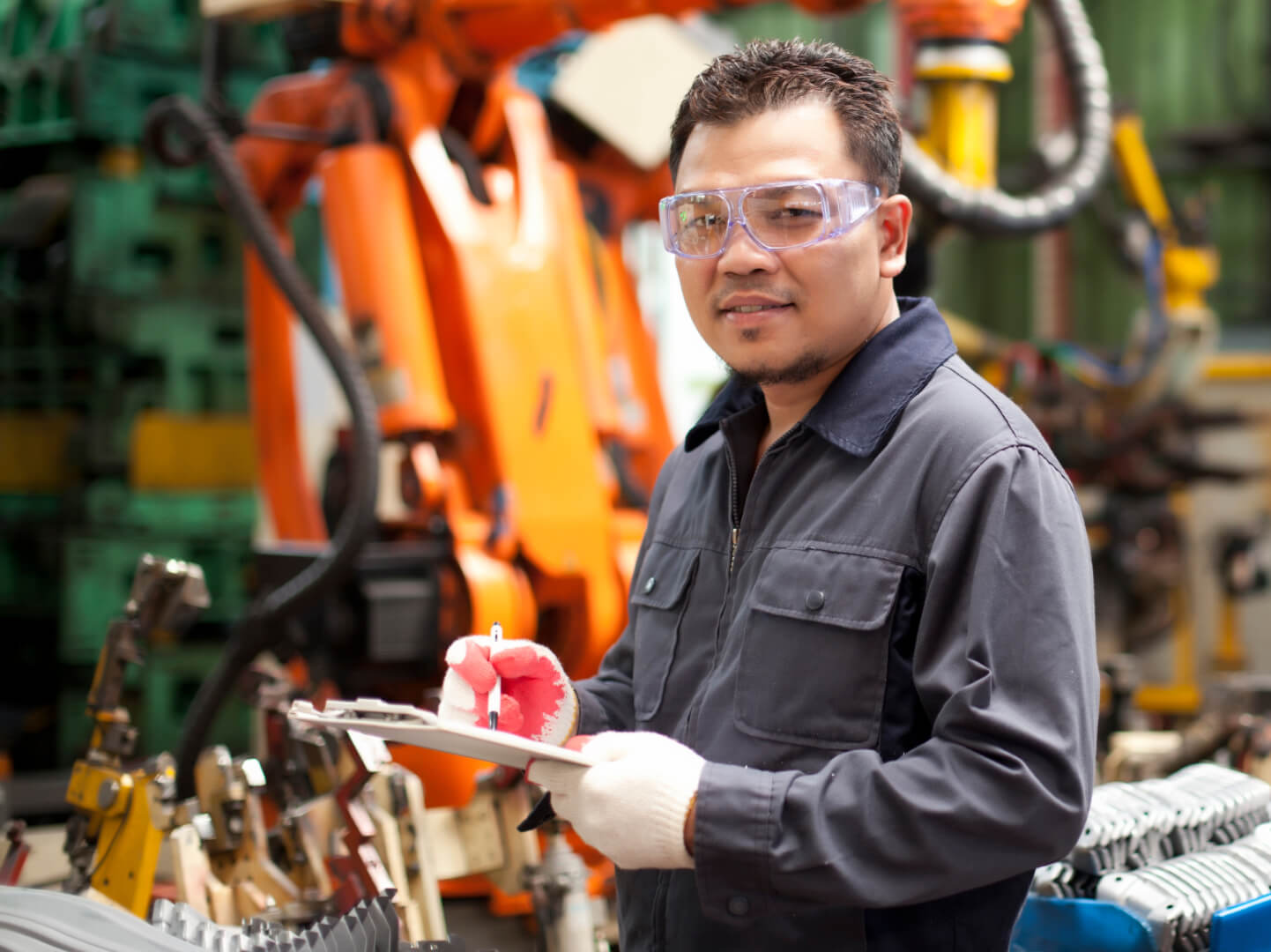 An industrial worker wearing safety glasses