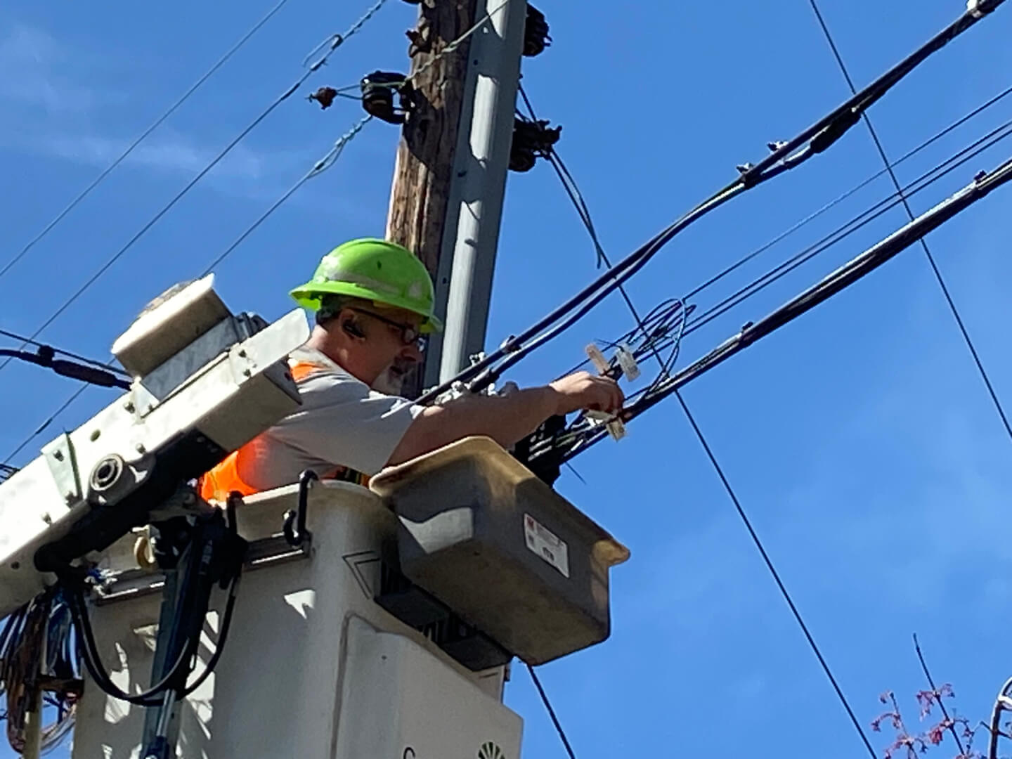 Man working on an electricity polr