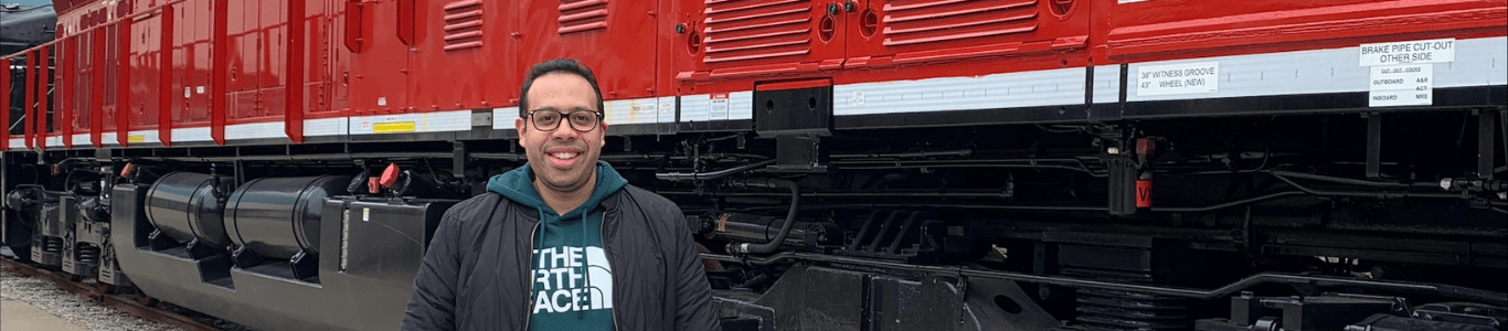 Man standing in front of Wabtec train 