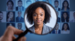Woman shown through a magnifying glass among dozens of other people