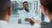 Man shaking hands and laughing