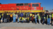 Group in front of train engine